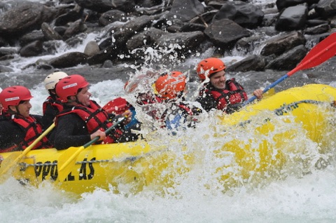 Raft hitting wave
